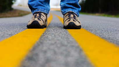 Values and Guidelines : Man's Feet on Yellow Highway Lines